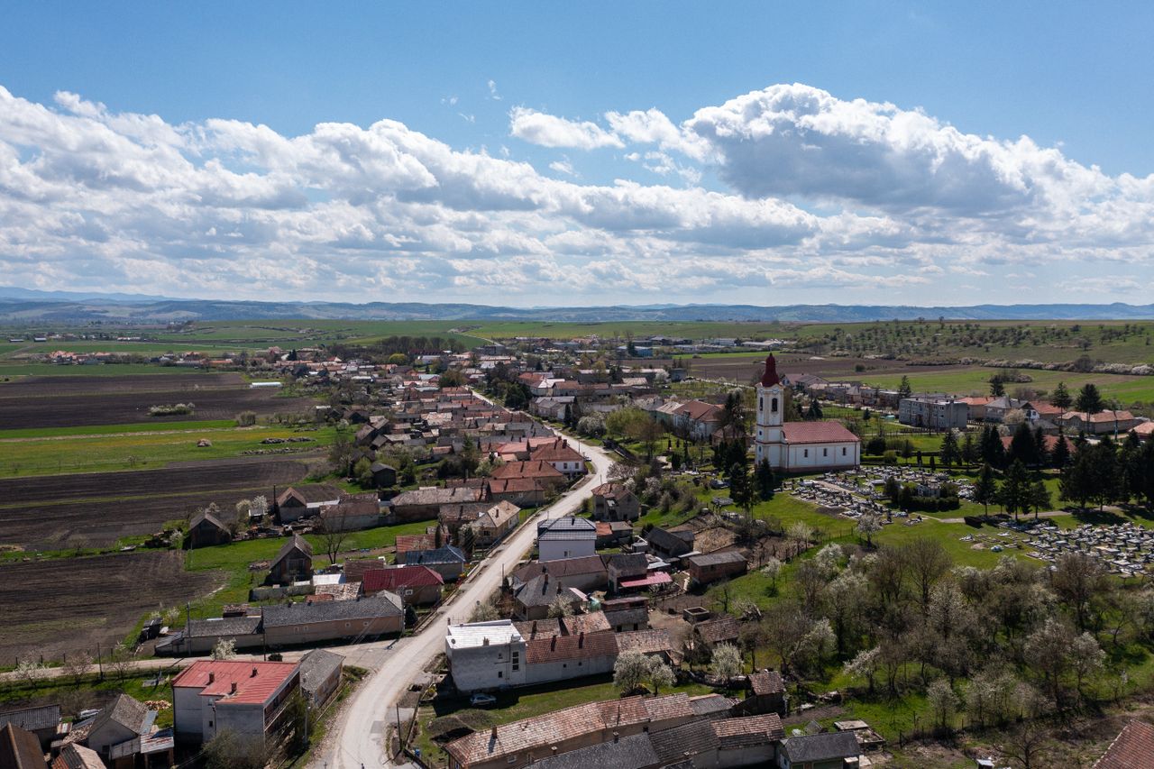 Beautiful aerial panorama of Chanava village, showcasing fields and architecture under a bright sky.